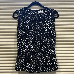 Sleeveless black with white dots top